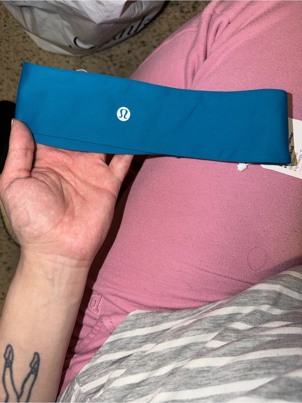 lululemon teal athletic headband with black logo detail